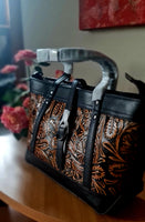 Borsa in pelle di vacchetta con primo strato scheletro intagliata a mano modello Eris Favolosa