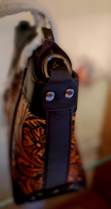 Borsa in pelle di vacchetta con primo strato scheletro intagliata a mano modello Eris Favolosa